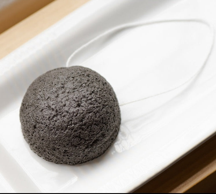 charcoal facial sponge by distinct bath & body