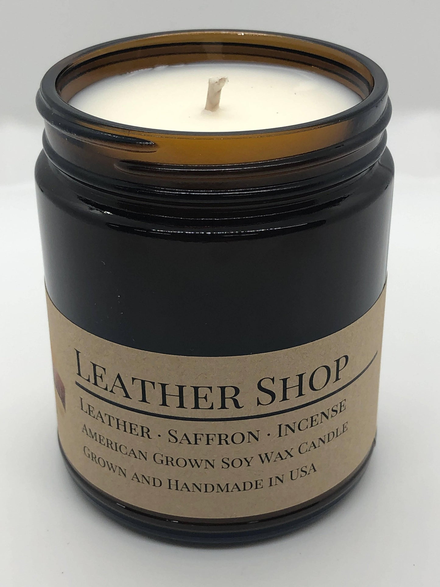 leather shop soy wax candle | 9 oz amber apothecary jar by prairie fire tallow, candles, and lavender