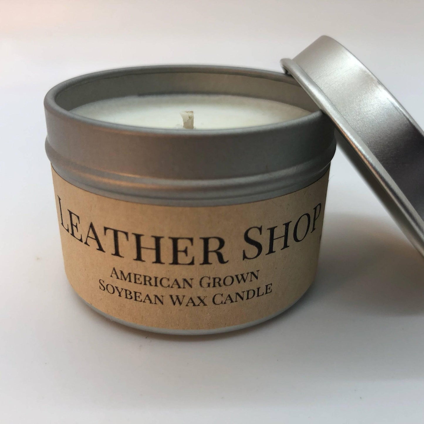 leather shop soy wax candle | 2 oz travel tin by prairie fire tallow, candles, and lavender