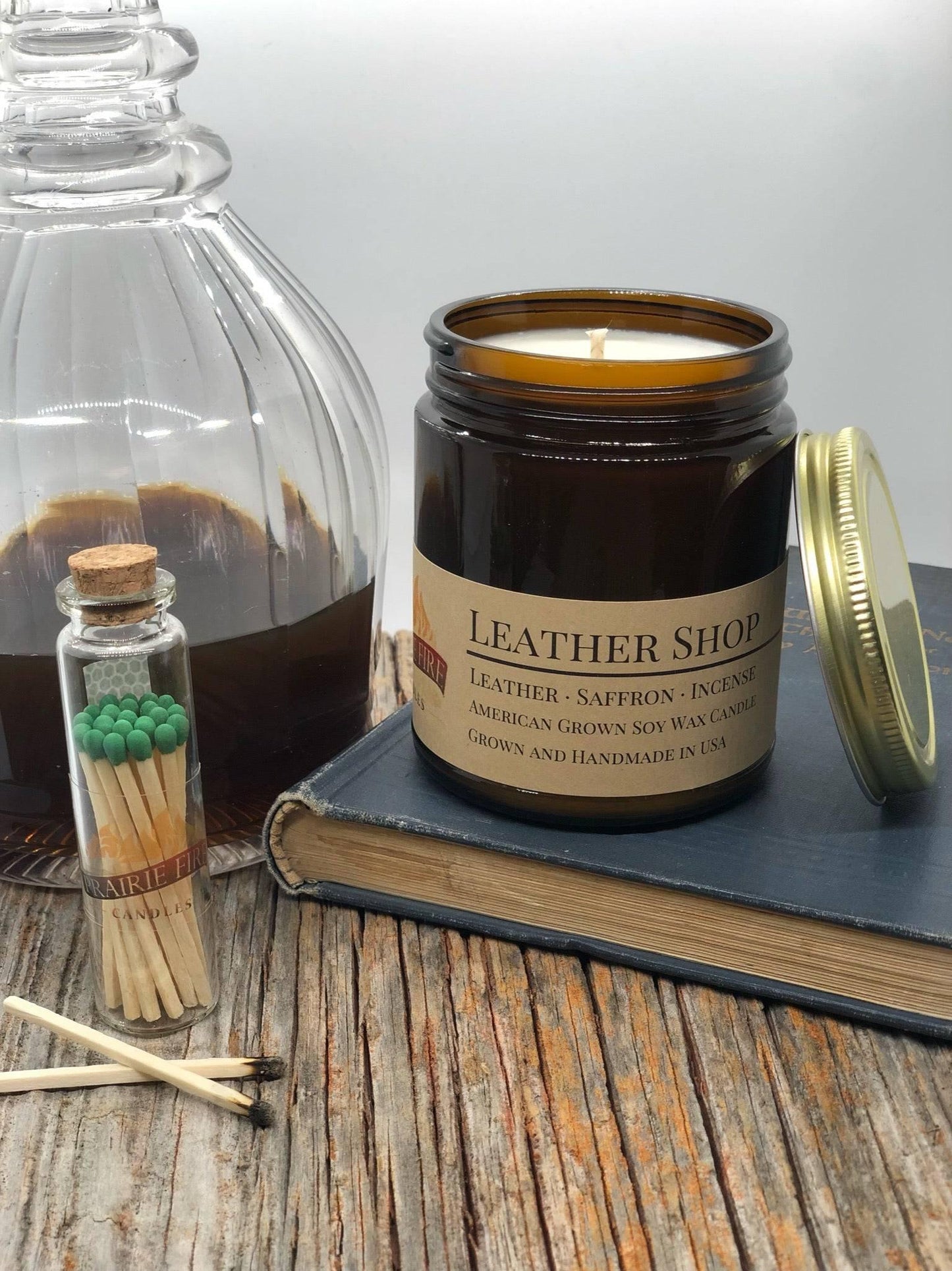 leather shop soy wax candle | 9 oz amber apothecary jar by prairie fire tallow, candles, and lavender